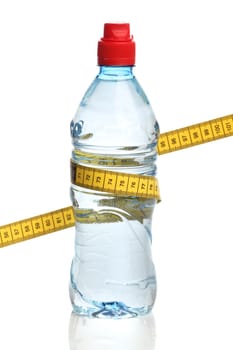 Bottle with water and a measuring tape isolated