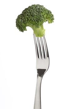 Fork with a broccoli isolated over white