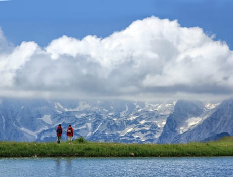 the tourists watching the panorama of the mountains
