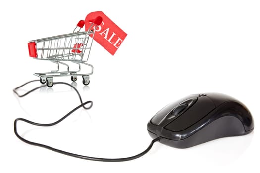 Internet sales concept. Computer mouse connected to the shopping cart.