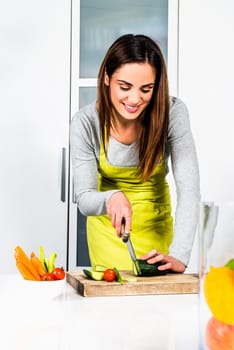 Young Woman Cooking. Healthy Food - Vegetable Salad. Diet. Dieting Concept. Healthy Lifestyle. Cooking At Home. Prepare Food