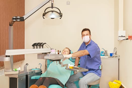 Dentist doctor and patient in dental clinic