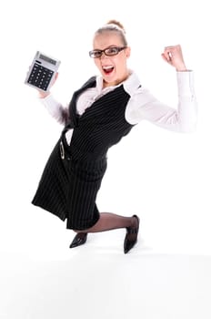 Young woman with blond hair in a pinstriped business suit (tax consultant,manager,secretary) stands in front of a white background and works joyfully with a large calculator.