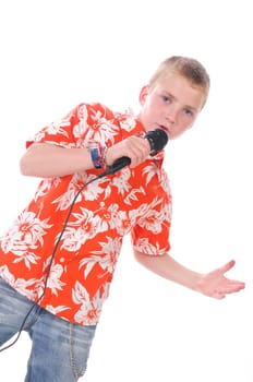 Blonde teenage boy wears a bright orange shirt and sings joyfully into a microphone,isolated against a white background.