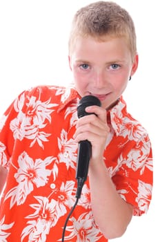 Blonde teenage boy wears a bright orange shirt and sings joyfully into a microphone,isolated against a white background.