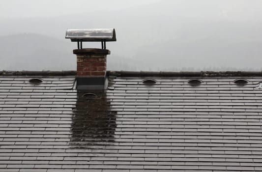 The old chimney on the top of the roof