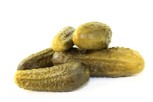 fresh pickles against a white background