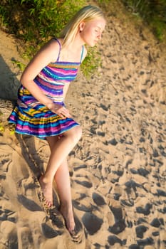 Woman in dress take sunbath at warm day