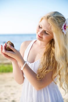 Woman in white dress marvel clam at hands