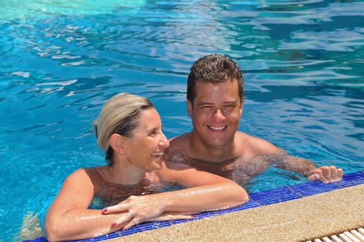 happy young  couple at summer vacation have fun and relax at beautiful sunny  day on beach