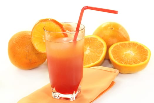 a glass of Campari orange and ice cubes