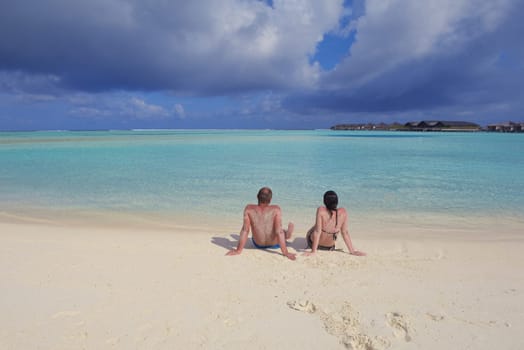 happy young  couple at summer vacation have fun and relax at beautiful sunny  day on beach
