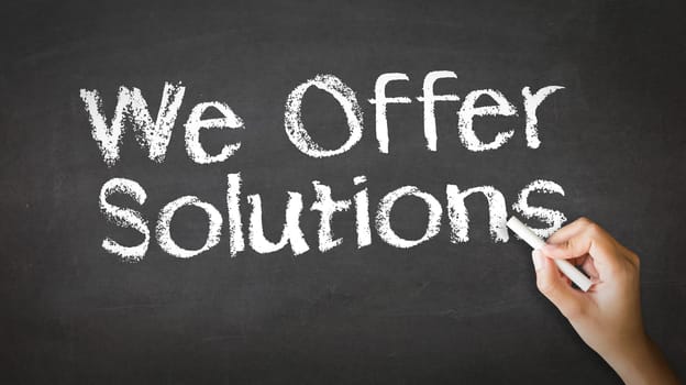 A person drawing and pointing at a We offer Solutions Chalk Illustration