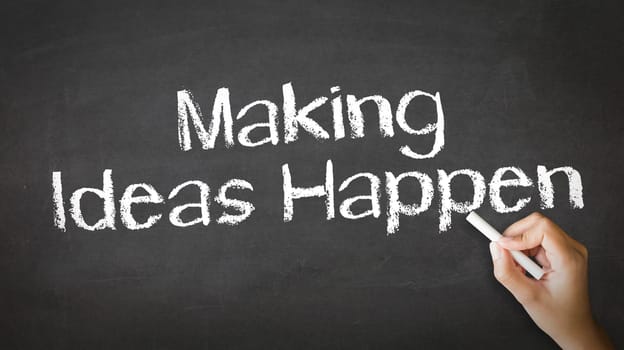 A person drawing and pointing at a Making Ideas Happen Chalk Illustration