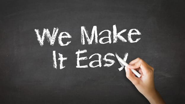 A person drawing and pointing at a We make it easy Chalk Illustration