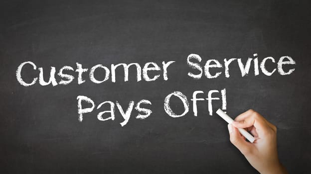 A person drawing and pointing at a Customer service pays off Chalk Illustration