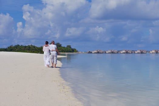 happy young  couple at summer vacation have fun and relax at beautiful sunny  day on beach