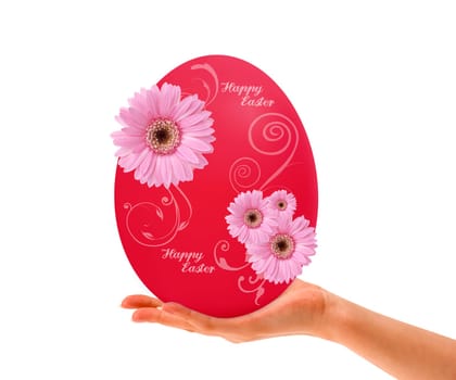 Hand holding Red Easter egg with pink flowers on white background.