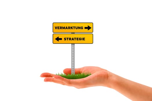 Hand holding holding a Vermarktung - Strategie street sign.