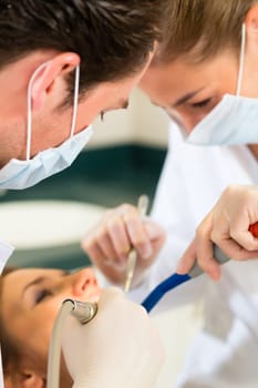 Patient at dentist - treatment with drilling