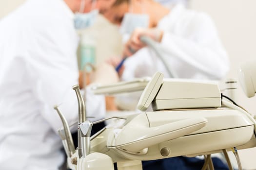Patient at dentist - treatment with drilling