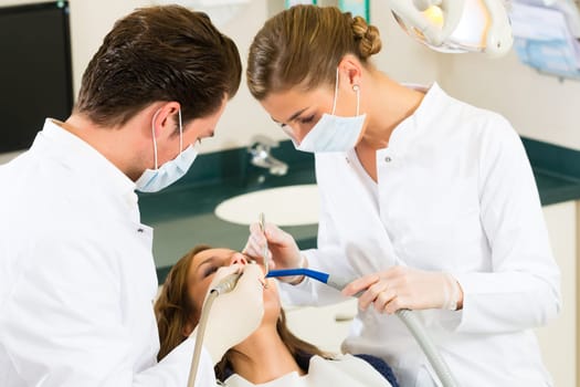 Patient at dentist - treatment with drilling