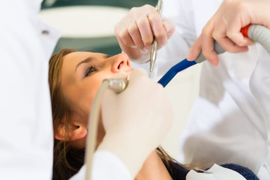 Patient at dentist - treatment with drilling