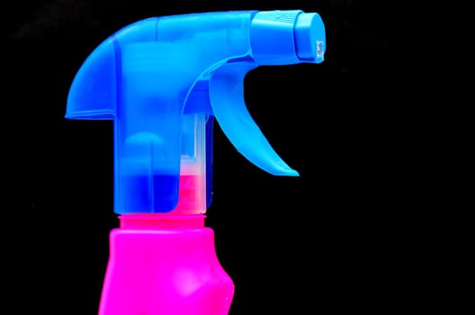 Colorful household spray in close up