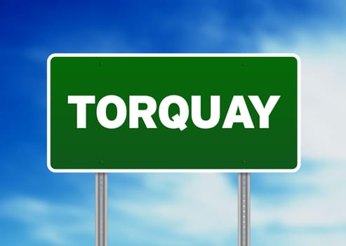 Green Torquay, England highway sign on Cloud Background.