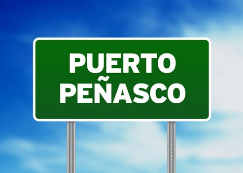 Green Puerto Peñasco, Mexico highway sign on Cloud Background.