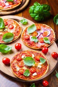 Traditional pizza with mozzarella, salami and basil