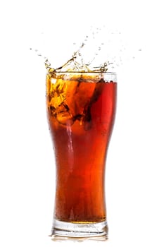 Cola glass with ice cubes over white background