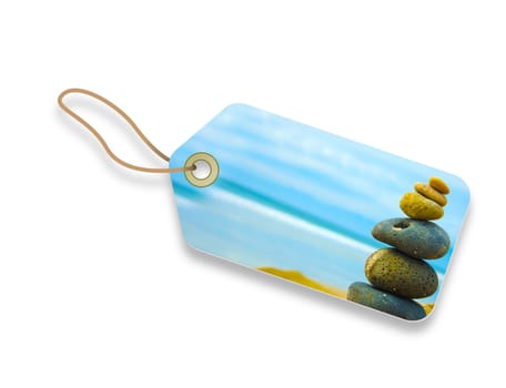 Price Tag with Zen Stone stacked together on blue blurred background