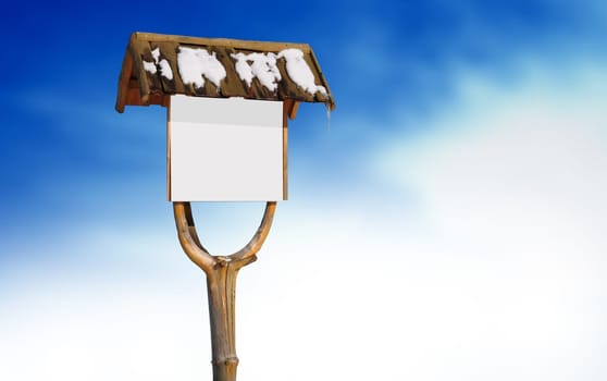 Wooden road sign with snow on cloud background.