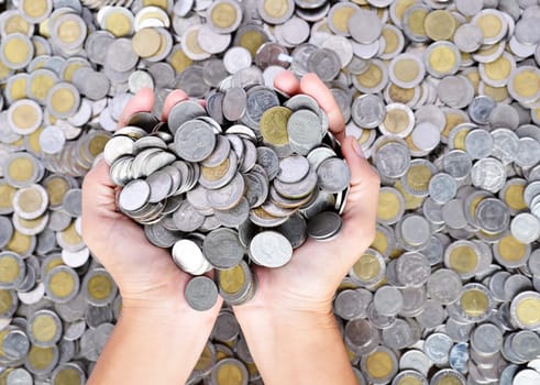 a lot of coins in the hands