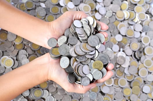 a lot of coins in the hands