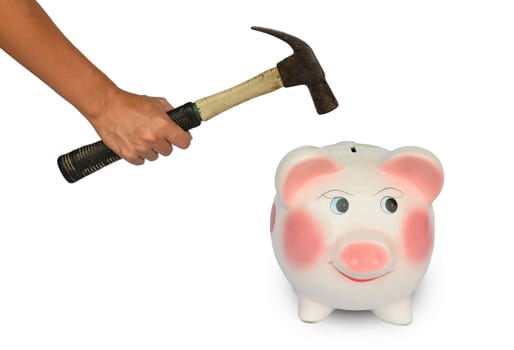 Piggy bank and hand with hammer isolated on white backgroung