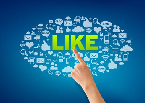 Hand pointing at a I Like Icon cloud on blue background.