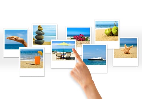 Hand pointing at serveral photos on white background