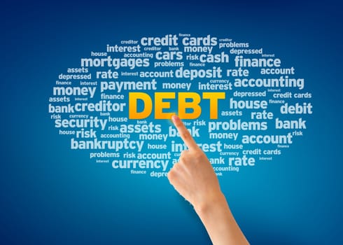 Hand pointing at a Debt Word Cloud on blue background.