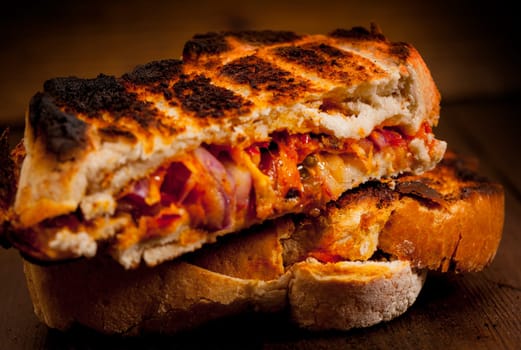 Toasted cheese, tomato and onion sandwich done on the BBQ.