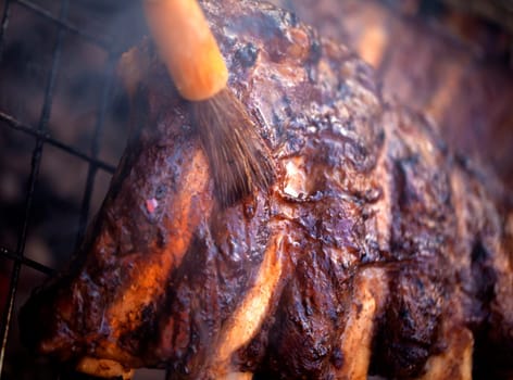 Beef ribs being roasted on the BBQ.