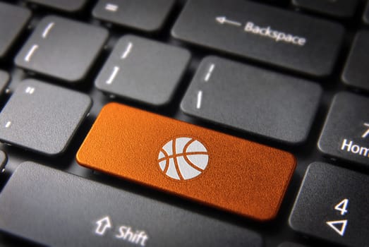 Sports key with basket ball icon on laptop keyboard. Included clipping path, so you can easily edit it.