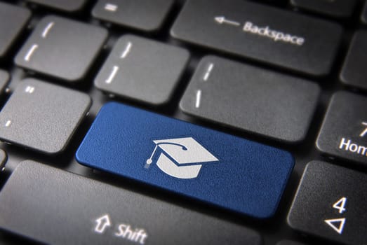 Education key with graduation hat icon on laptop keyboard. Included clipping path, so you can easily edit it.
