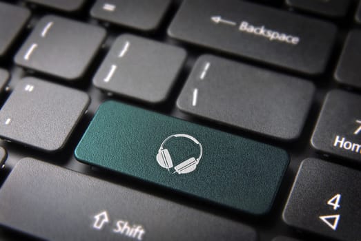 Entertainment key with headphones icon on laptop keyboard. Included clipping path, so you can easily edit it.