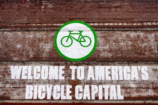 A red and white brick will with a large sign over it in Portland, Oregon