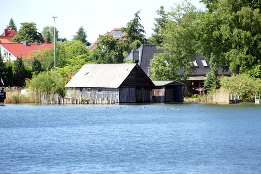 The photograph of a boat shed at Lake Müritz.