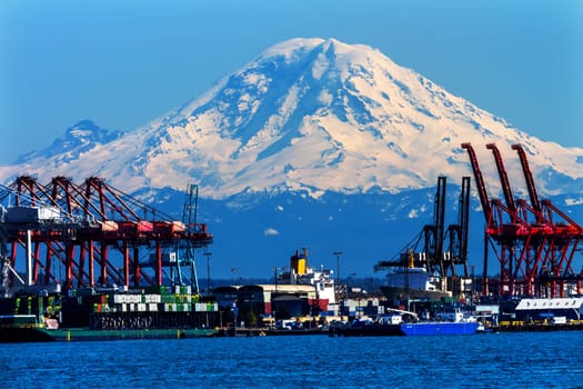 Seattle Port with Red Cranes and Ships Barges Pier and Dock Mt Rainier in the Background