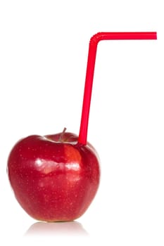 Red apple with  straw over a white background