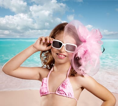 Children girl in tropical turquoise beach vacations with pink fashion style vintage color